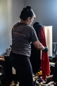 CRS employee handling damaged contents